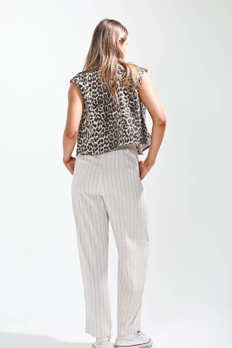 Leopard printed button down vest.